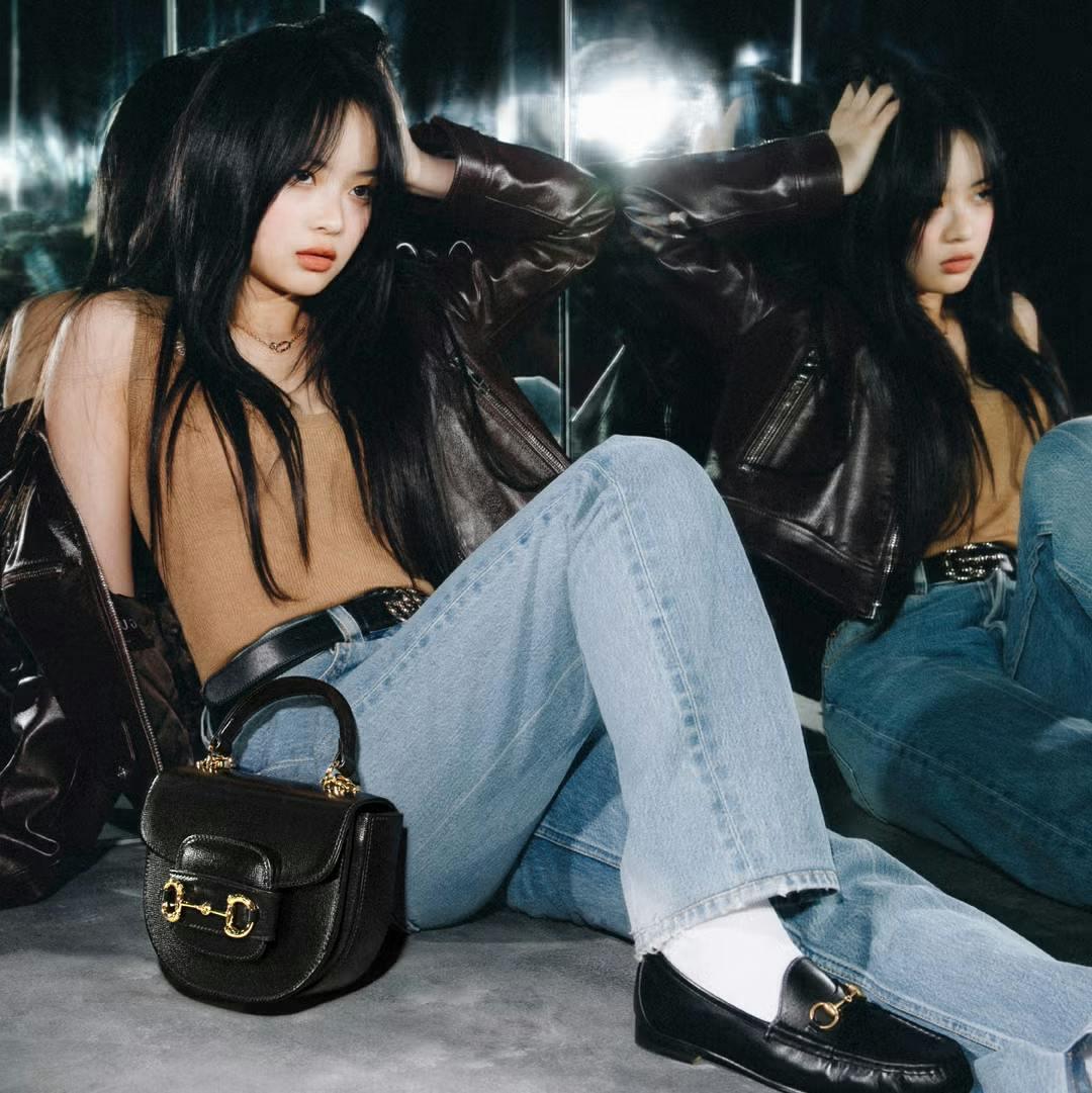 clothing pants accessories bag handbag jeans black hair person purse face